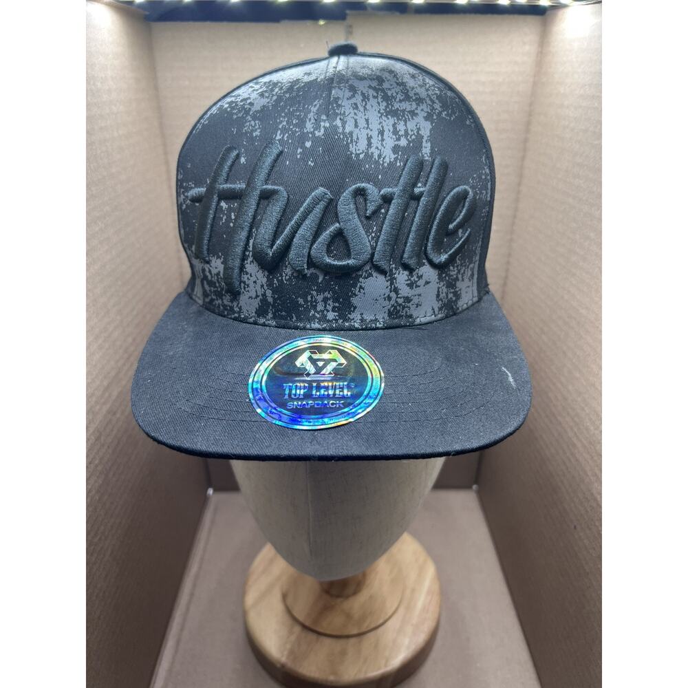 Hustle OG Snapback Hat Black With Splatter Paint background Embroidered Spellou